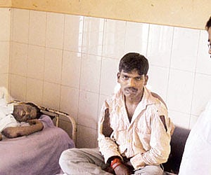 ZP Social Justice Committee president M P Chandresh calling on the injured dalits at Muthur village, Periyapatna taluk.