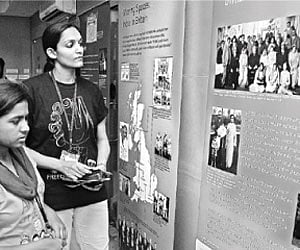 Students having a look at the photos on display at Beyond The Frame Exhibition at Tuesday | a suresh kumar the British Library on Tuesday.