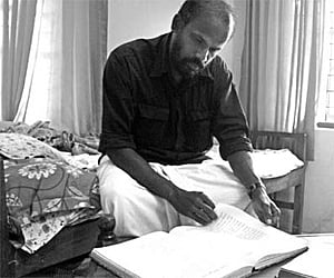 Satheesh G Bhaskar scanning his collection at his residence at Chakkittapara near Perambra in Kozhikode | Express Photo