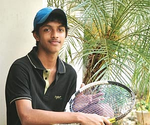 Paramedics attending to 15-year-old Prem, who was injured  after his hand got caught while alighting an escalator (R) at Chepauk railway station.