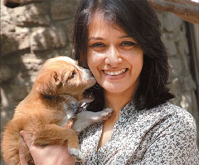 Amala Akkineni is all smiles with a rescued dog at the Blue Cross animal shelter in Hyderabad