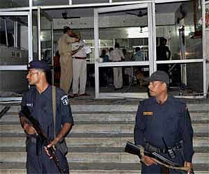 Security officers at the site of a blast in Agra on Saturday. PTI