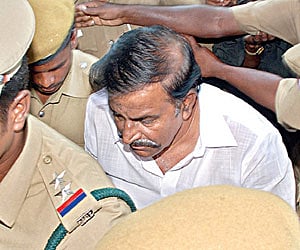Former Minister K N Nehru being brought to a court in Tiruchy for producing him in another land grab case on Thursday.