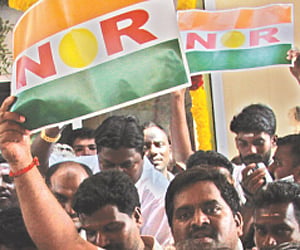 rising ambitions: Workers of All India N R Congress with the party flag in Puducherry on Monday.