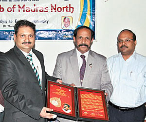 Sanjay receiving the Rotary award. EPS