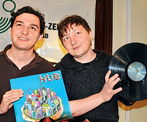 Andy (left) and Hannes Teichmann show off their musical work during a media conference in Hyderabad on Monday