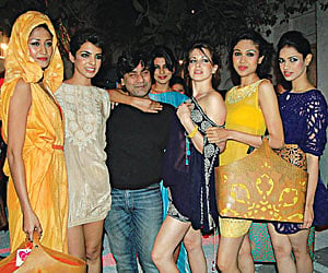 Raakesh Agarwal with models displaying his creations