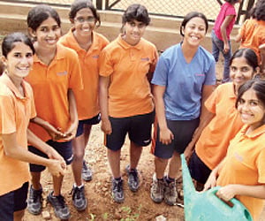 Students watering plants at Inventure Academy.