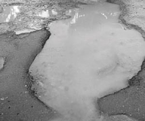 A large pothole at Manorama Junction.
