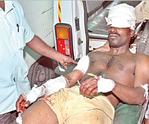 tragic turn: Thanigaivannan, who was injured when his uncle opened fire over a family dispute at Karikalampakkam, getting medical attention at Indira