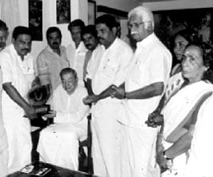 Deputy chief minister Damodar Raja Narsimha handing over a model of the transformer to CMD of Power Grid Corporation S K Chaturvedi (left), in Hyderab