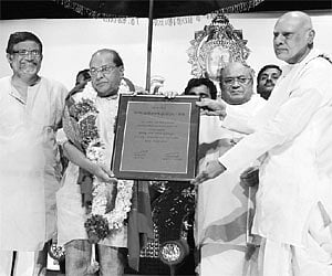 Former chief minister K Rosaiah presenting the Tanikella Bharani Sahitya Puraskaram to V Mohan Prasad at a function in Hyderabad on Thursday.