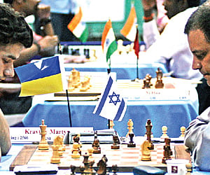 Chennai Open winner Martyn Kravtsiv of Ukraine (left) contemplates a move while playing Israeli GM Alon Gree nfeld in the 11th and final round at SDAT