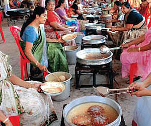 Women preparing the offering ‘Valiyappam’ at St Thomas Jacobite Syrian Church, Paravoor, on Wednesday | Express