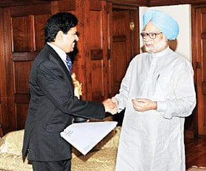 Magician Gopinath Muthukad  with Prime Minister Manmohan Singh in New Delhi the other day