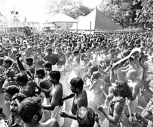 Devotees and oracles swarming the premises of Kodungallur Bhagavathy Temple as part of the ‘Kavu Theendal’ ritual on Sunday