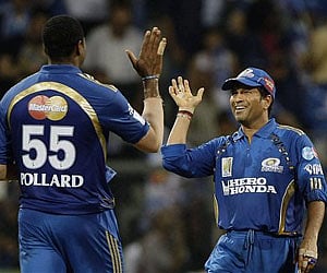 Mumbai Indians' Kieron Pollard and Sachin Tendulkar, right, celebrate during an IPL cricket match. (File Photo, AP)