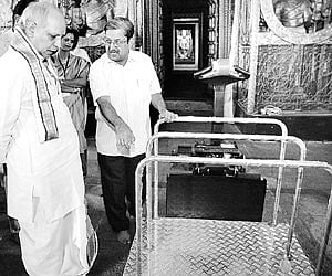TTD Executive Officer I Y R Krishna Rao inspecting the moving platform during its trial run at the replica of Ananda Nilayam in Tirupati, Thursday|EPS