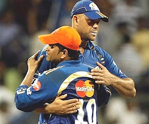Mumbai Indians skipper Sachin Tendulkar and his teammate Andrew Symonds after they won the IPL match against Kings XI Punjab in Mumbai on Monday. AP