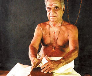 Patakam maestro P K Narayanan Nambiar plays the mizhavu (copper drum) too