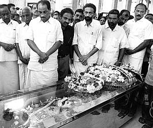 Excise Minister K Babu paying homage to Fr Paul Kariyatty at St George Basilica in Angamaly