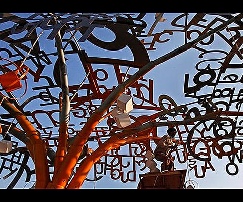 Image used for representative purpose only. A worker works on an installation made of Hindi and English alphabets during a Republic Day parade rehearsals in New Delhi. 