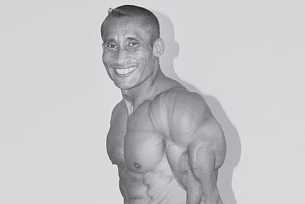 Flexing his muscles 