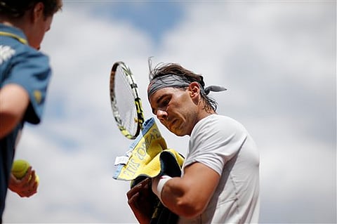 Sharapova wins easily in Paris; Nadal starts slow 