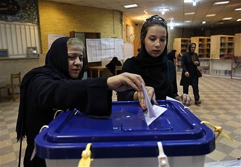 Iran voters draw spirit in showdown atmosphere 