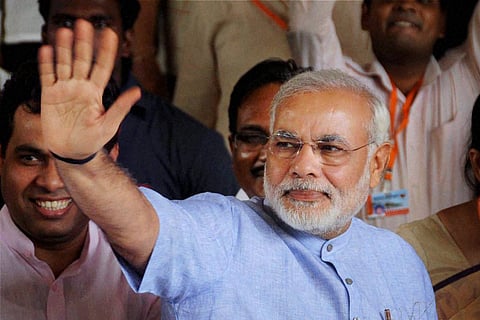 Monsoon showers cannot hide Modi's grin