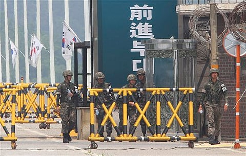 Koreas agree to talk Sunday in bid to ease tension