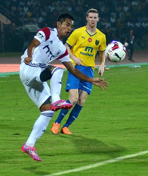 Players of North East United FC in white jersey and Kerala Blasters FC in yellow jersey in action during the Indian Super League 2014 at Indira Gandhi Athletic Stadium in Guwahati on Monday | PTI