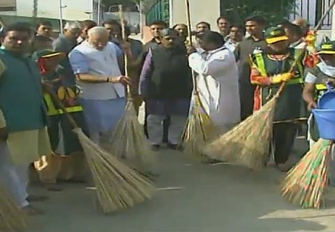 Prime Minister wields the broom as he launches the Swachh Bharat Mission at New Delhi | Image Courtesy: DD National 