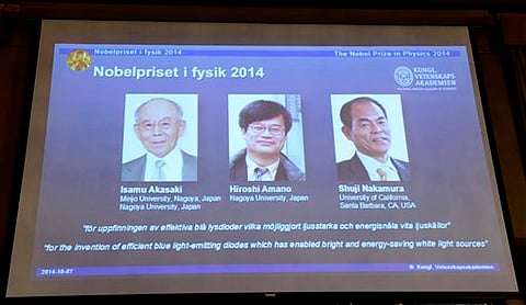 Projected images of Isamu Akasaki, Hiroshi Amano and Shuji Nakamura are displayed as its announced at the Royal Swedish Academy of Science in Stockholm, Tuesday | AP