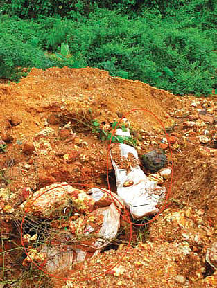 Rain Exposes Corpses in Graveyard