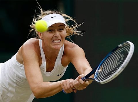 Maria Sharapova of Russia plays a return to Alison Riske of U.S. during their women's singles match at the All England Lawn Tennis Championships in Wimbledon, London, Saturday, June 28, 2014. (AP Photo/Ben Curtis)