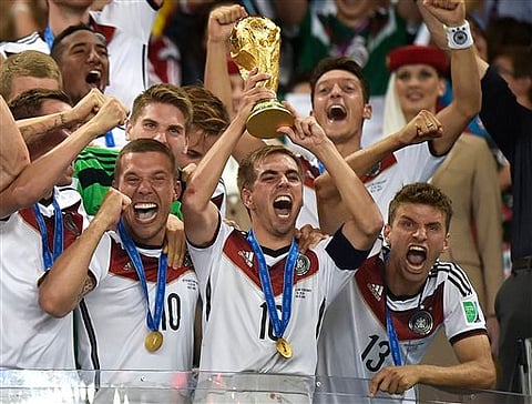 Philip Lahm holding World Cup