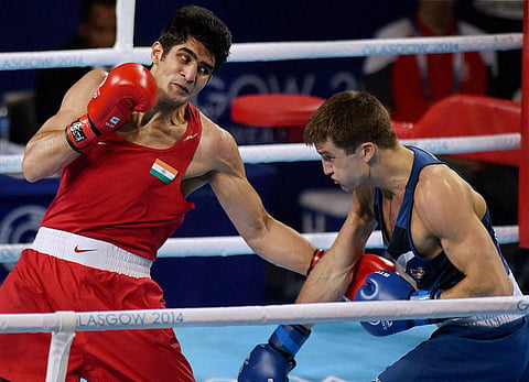 Vijender Singh in action against England's Antony Fowler in the Final of men's Middle 75kg during the 2014 Commonwealth Games in Glasgow Scotland on Saturday | PTI