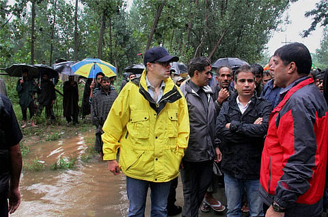 Chief Minister of Jammu and Kashmir Omar Abdullah talking to flood-affected people in Pulwama on Friday | PTI