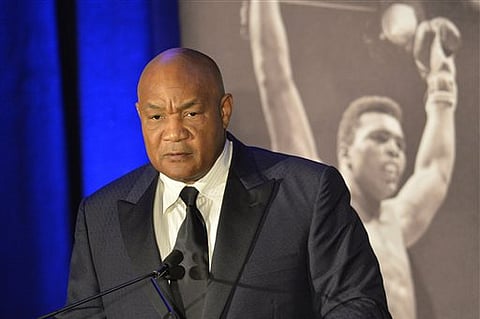 Former heavyweight boxing champion George Foreman gives a stern look to Muhammad Ali during the Sports Illustrated Legacy Awards. |AP