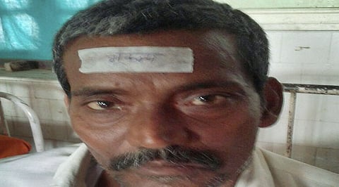 An earthquake victim with a 'bhukamp' sticker on his forehead at a hospital in Darbhanga (PTI)