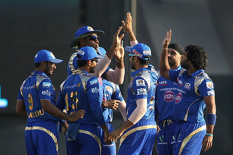 Kieron Pollard of Mumbai Indians and Lasith Malinga of Mumbai Indians are congratulated for getting Virender Sehwag of Kings XI Punjab wicket during IPL match in Mohali on Sunday | PTI