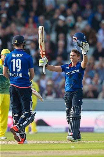 England's James Taylor raises his bat after reaching 100 during the One-Day International cricket match between England and Australia at Old Trafford cricket ground in Manchester, England. | AP Photo