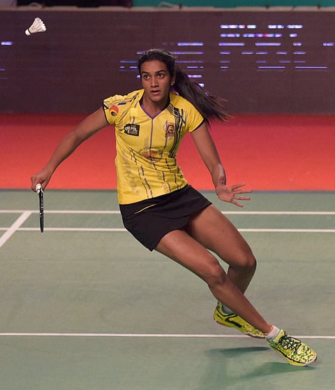 Chennai Smashes PV Sindhu in action against Mumbai Rockets Han Li in the women's singles match of the Premier Badminton League at NSCI Worli on Sunday. | PTI