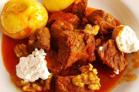 Stifado, braised beef with feta cheese and onions | Reuters