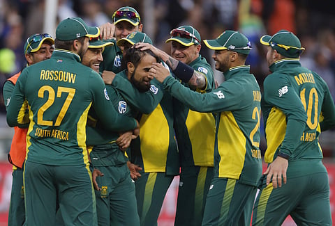 South Africa's Imran Tahir, center, celebrates with teammates after taking the wicket of Australia’s Aaron Finch, during their 5th One Day International in Cape Town. | AP