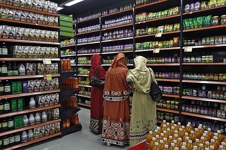Customers shop inside a retail outlet at a shopping mall. (File | Reuters)