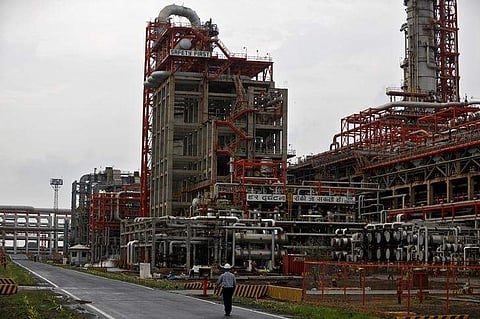 An employee walks inside the premises of an oil refinery of Essar Oil, which runs India's second biggest private sector refinery, in Vadinar in the western state of Gujarat, India. | Reuters