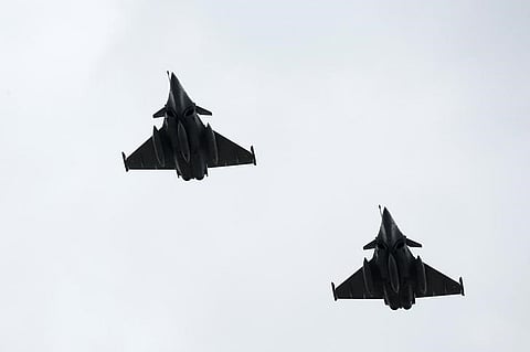 Dassault Rafale fighter jets fly over the Pyramid of the Louvre Museum as part of a rehearsal of the traditional Bastille Day military parade in Paris | Reuters