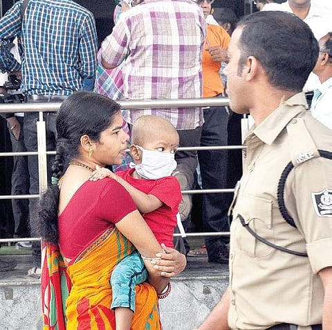 Relatives of patients waiting outside the SUM Hospital in Bhubaneswar on Tuesday, as restrictions were imposed on entry to the hospital after Monday’s  fire  mishap | Biswanath Swain